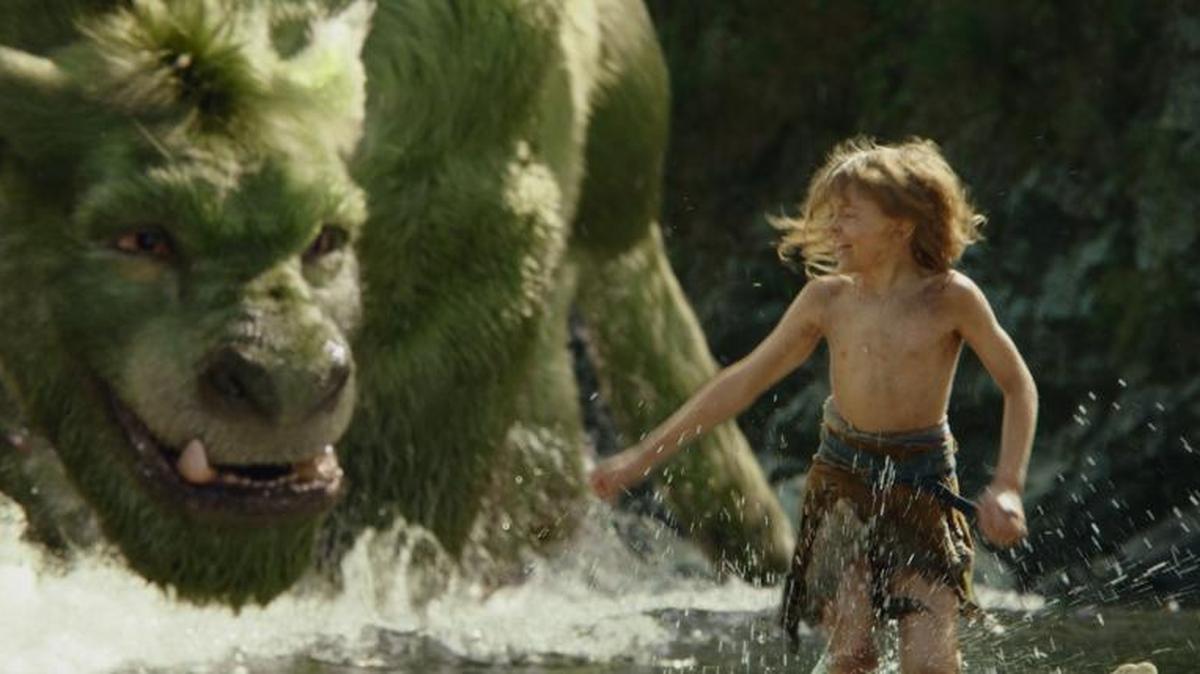 This image released by Disney shows Oakes Fegley in a scene from "Pete's Dragon."