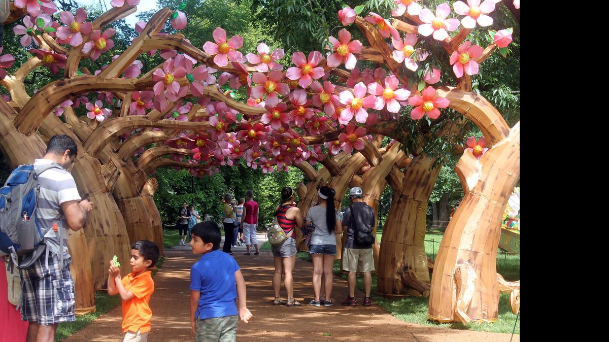 
The flowering cherry tree arches are a great photo backdrop at Missouri Botanical Garden in St. Louis. The silk flowers are part of the Lantern Festival that runs through Aug. 23.The sets are impressive during the day, but spectacular at night.
