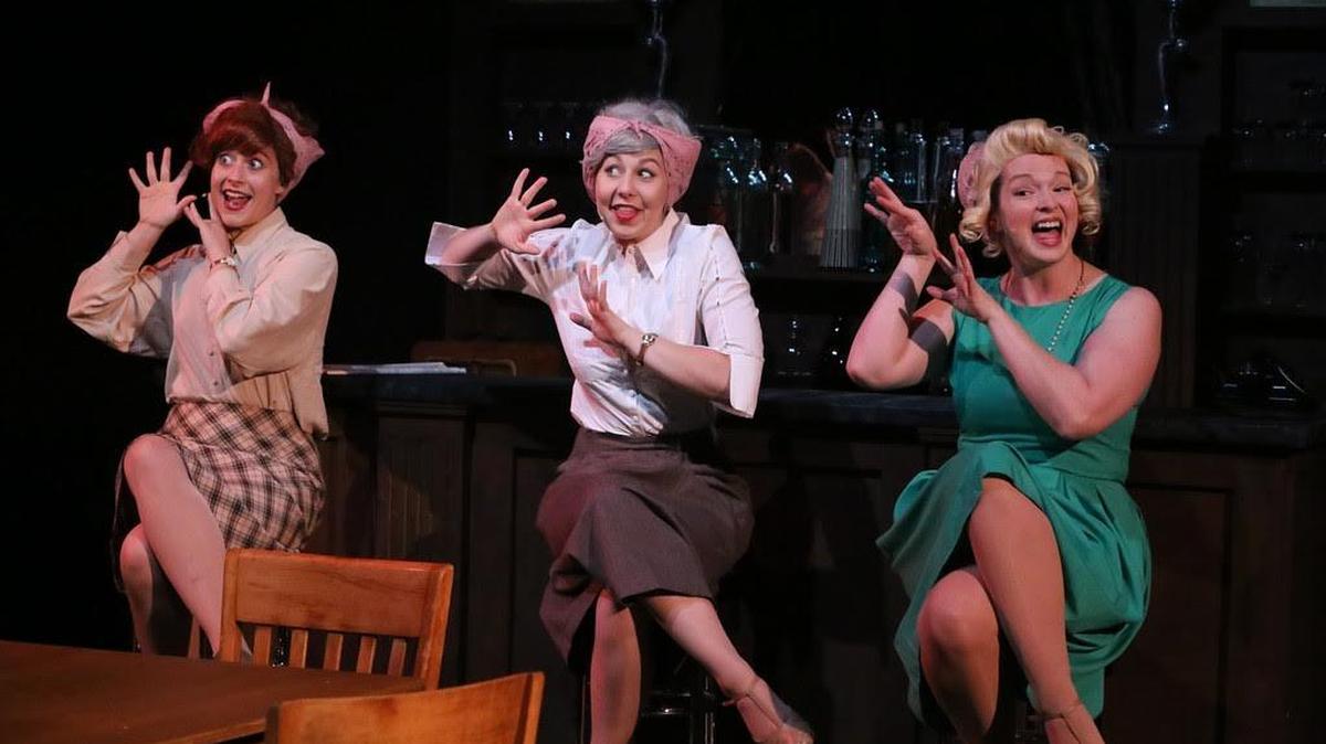 Trio Larissa White, Victoria Valentine and Ann Hier perform "Holes in the Doughnuts" in the rock musical “Atomic” at New Line Theatre in St. Louis.