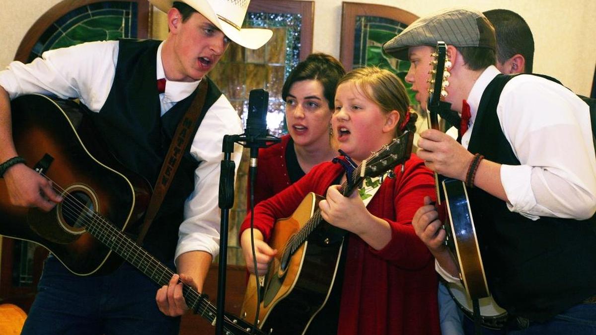 The Worthing10s Family Bluegrass Band recently performed at Oak Hill senior center in Waterloo. From left, Matthew, Emily, Joy, Nathanael and Lucas (hidden) harmonize. The band will open for George Portz and Friends of Bluegrass.