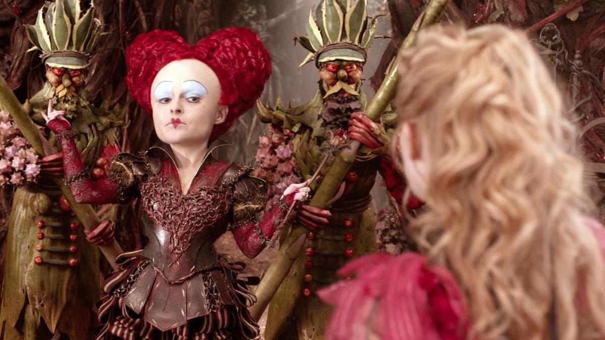 Helena Bonham Carter, left, and Mia Wasikowska appear in a scene from "Alice Through The Looking Glass."