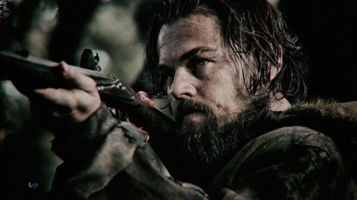 Leonardo DiCaprio takes aim in a scene from “The Revenant.”