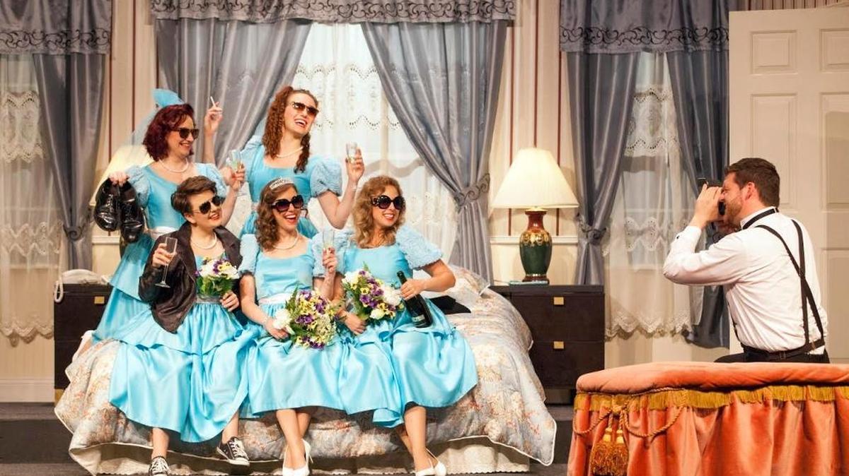 Kevin O’Brien (Tripp) has the bridesmaids in “Five Women Wearing the Same Dress” pose. They are, back row, left, Sarajane Alverson (Trisha) and Frankie Ferrari (Mindy), and front row, Lindsay Gingrich (Meredith), Eileen Engel (Frances) and Shannon Nara (Georgeanne). The play is at Stray Dog Theatre.