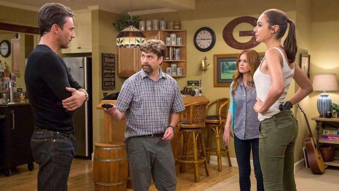 Tim Jones (Jon Hamm), left, Jeff Gaffney (Zach Galifianakis) and his wife Karen (Isla Fisher), and Natalie Jones (Gal Gadot) are neighbors in "Keeping Up With the Joneses."