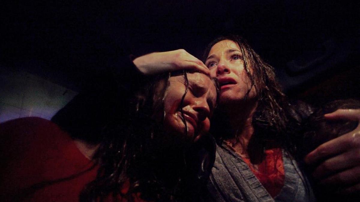 
Olivia DeJonge, left, and Kathryn Hahn appear in a scene from “The Visit.”
