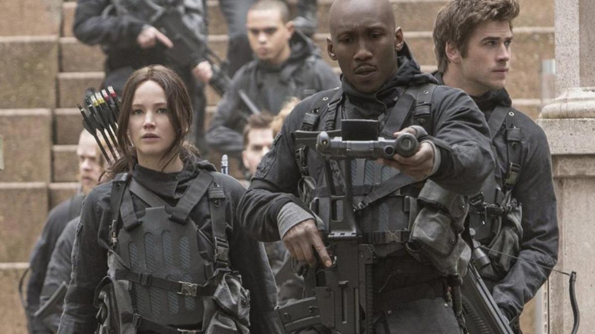 Jennifer Lawrence, Mahershala Ali and Liam Hemsworth in a scene from “The Hunger Games: Mockingjay — Part 2.”