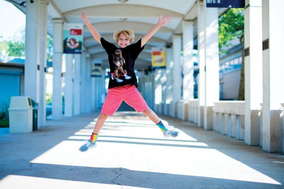 Tommy Cook, 10, of Belleville, plays the newsboy in “The Unsinkable Molly Brown” at The Muny.