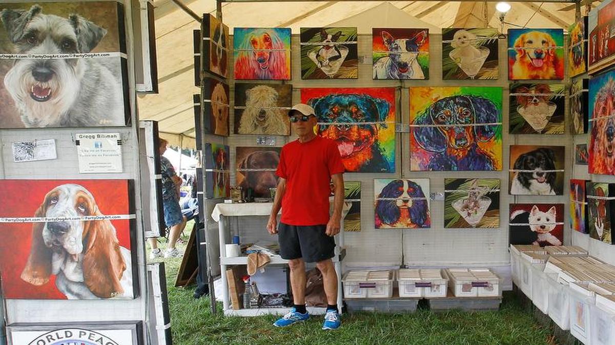 Gregg Billman with his digital dog art that he makes using a mix of traditional and high-tech methods. He is from Gainesville, Fla. See a gallery of photographs and a video at bnd.com .