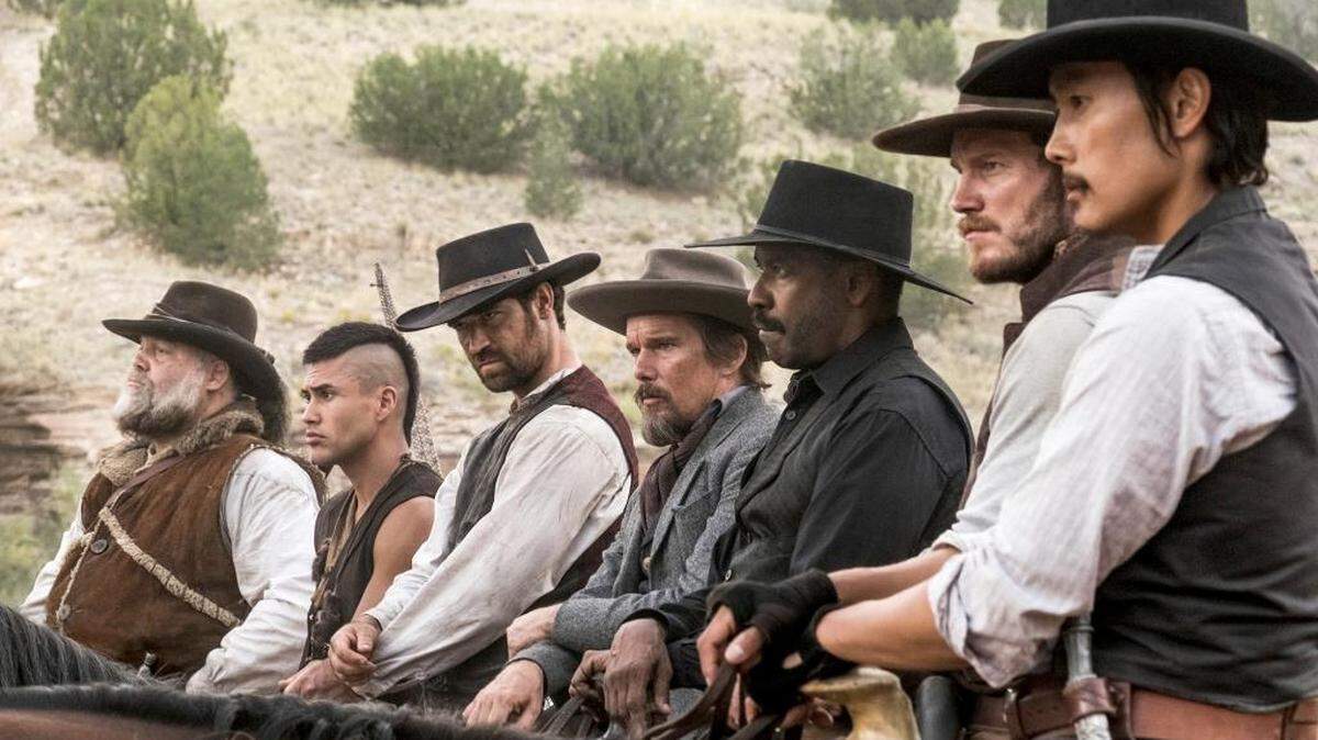 Vincent D'Onofrio, left, Martin Sensmeier, Manuel Garcia-Rulfo, Ethan Hawke, Denzel Washington, Chris Pratt and Byung-hun Lee in “The Magnificent Seven.”