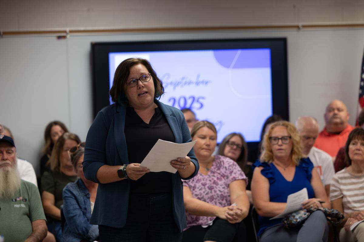 Carrie Clayton, a former teacher in the Columbia school district, speaks to the Columbia school board about the resignation of high school English teacher Mary Adams after she allegedly posted a Charlie Kirk quote on social media around the time he was shot and killed.