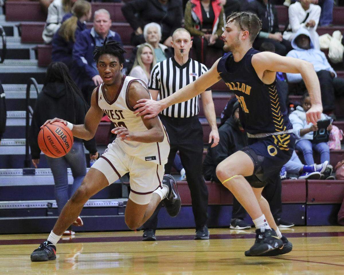 Belleville West guard David Marshall Jr. works past O’Fallon’s Koby Wilmoth during a Southwestern Conference game Jan. 13. For the second consecutive week, Marshall Jr. won the Belleville News-Democrat Boys Player of the Week high school basketball poll, as selected by readers of bnd.com.