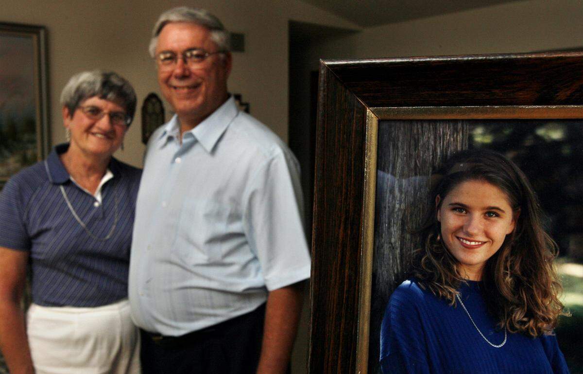 This file photo shows Tom Smith and his wife, Fran, who is now deceased, in 2007, when they were preparing for a fundraiser for the Karla Smith Foundation, now Karla Smith Behavioral Health. At right is a photo of their daughter, Karla, who committed suicide at 26.