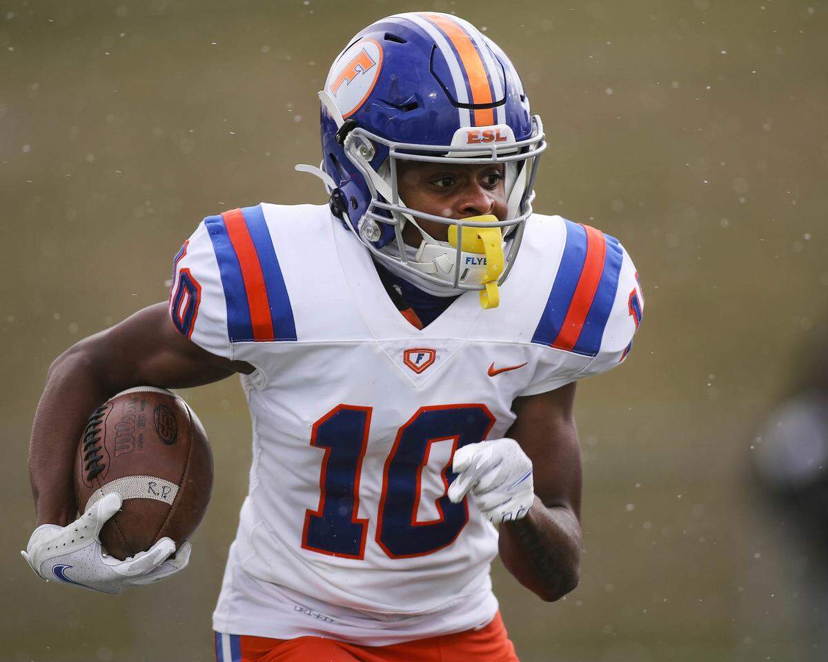 East St. Louis running back Jesse Watson carries the ball during the IHSA Class 6A semifinal game against Lemont. The Flyers won 32-29 and now will face Crystal Lake Prairie Ridge in the state championship game.