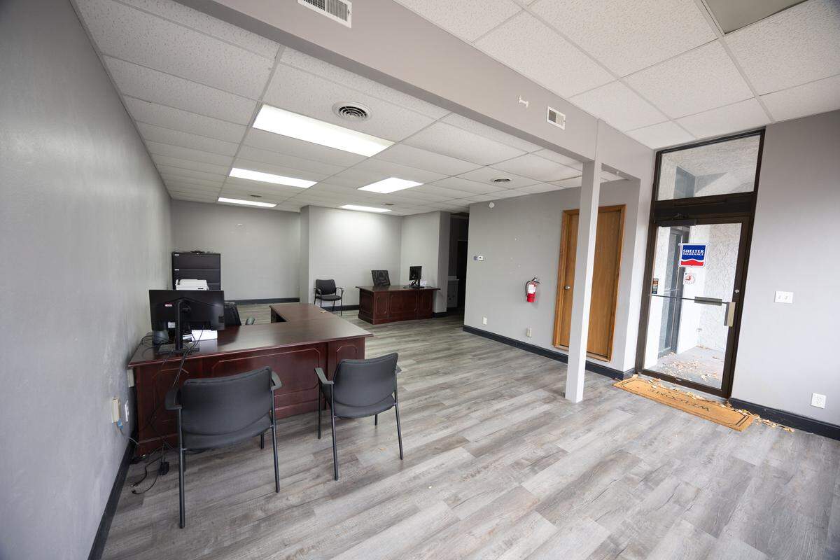 The lower floor of 204 West Main Street is zoned for commercial use and is currently leased to an insurance company.