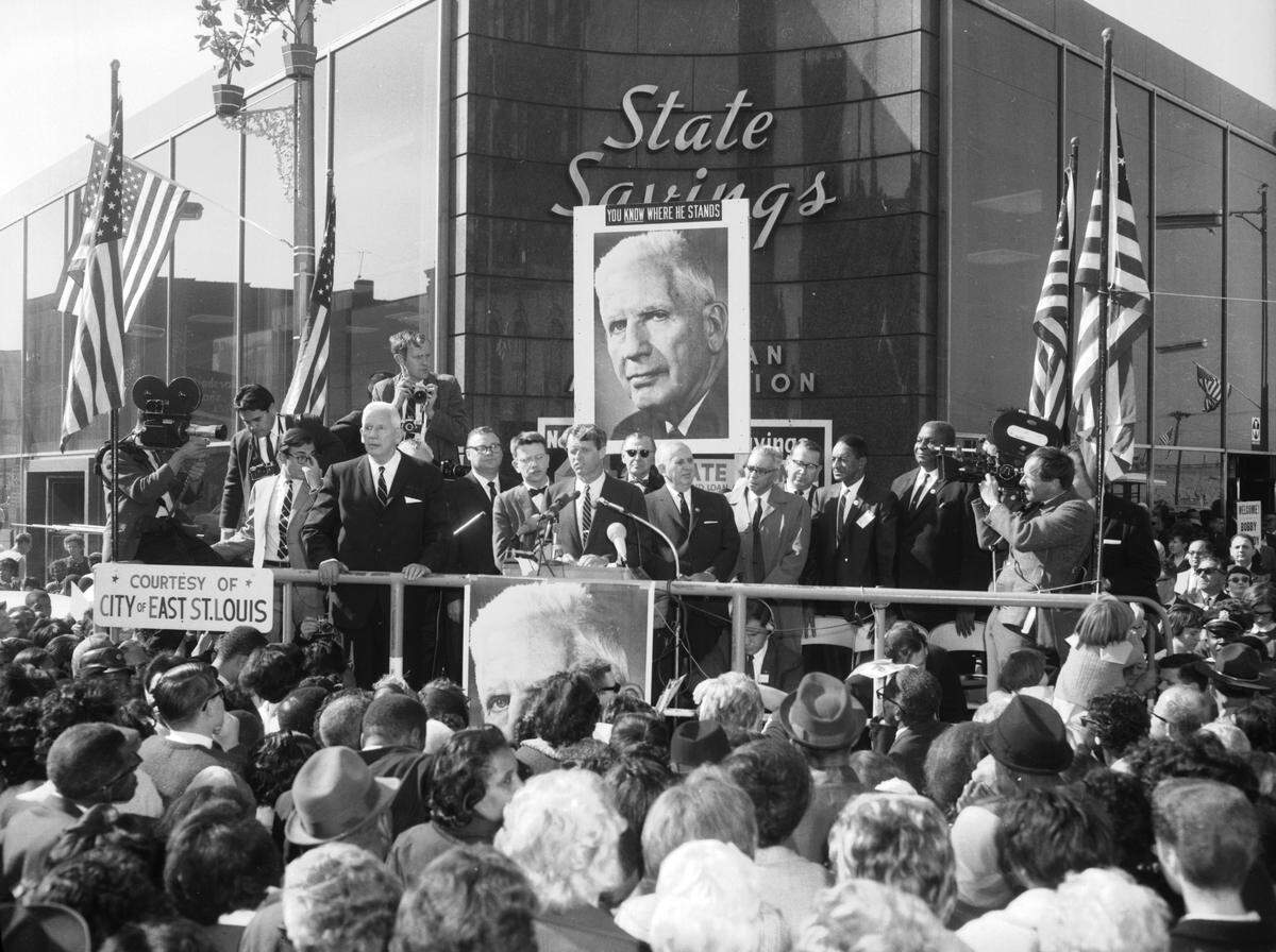 Sen. Robert Kennedy and dignitaries on a grand stand on the corner of Missouri and Collinsville Avenues in East St. Louis in October 1966.