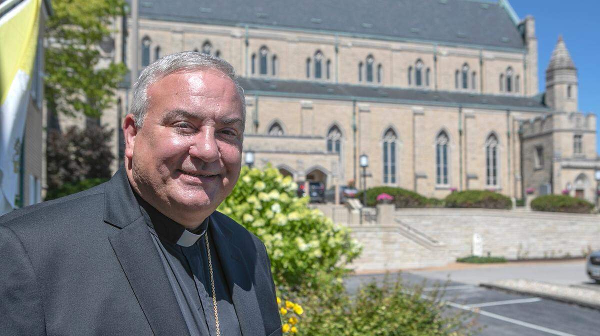 The Rev. Michael G. McGovern, who will become the ninth bishop of the Catholic Diocese of Belleville on Wednesday, stands outside the Cathedral of St. Peter in Belleville.