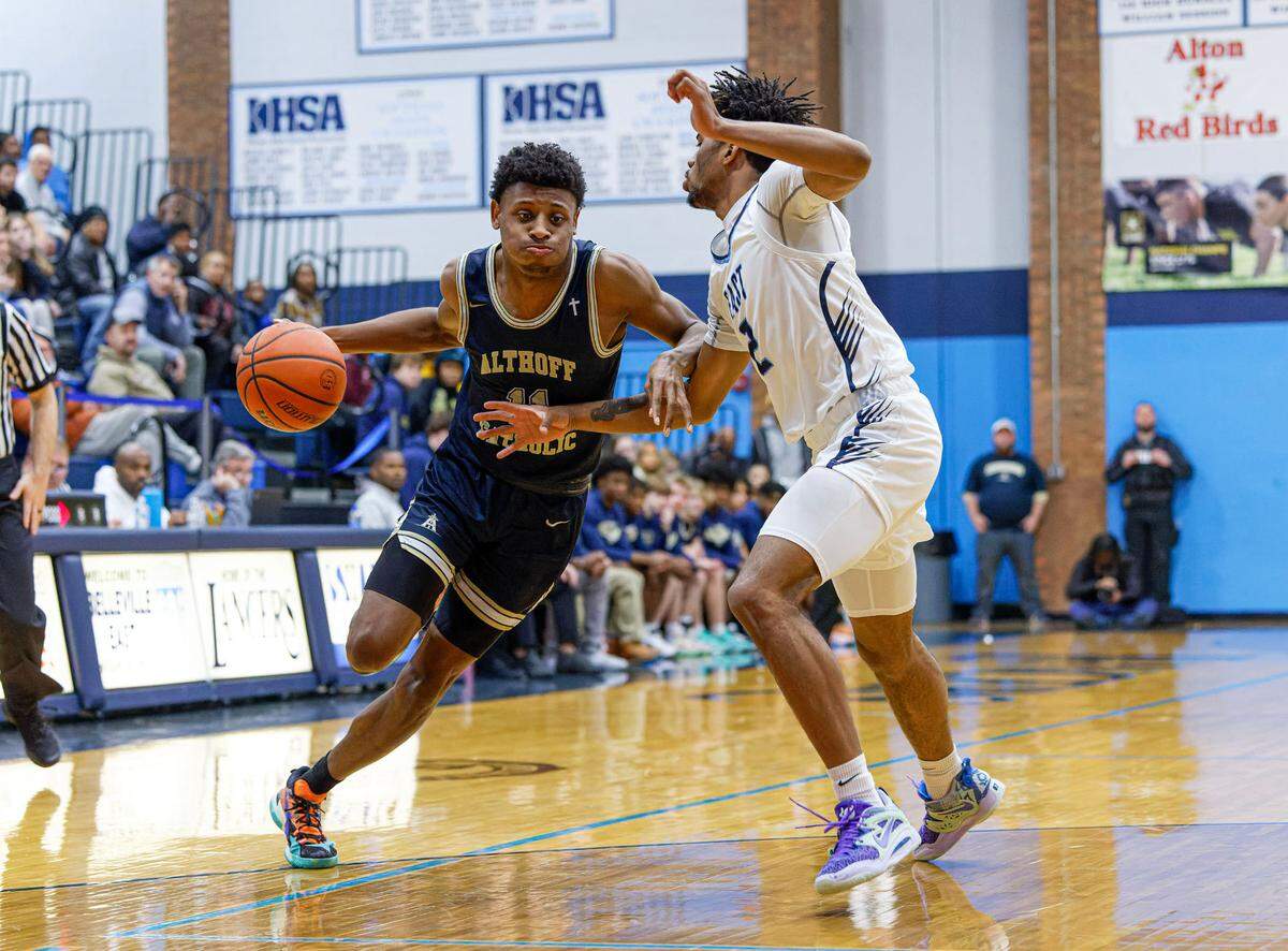 Althoff’s Taylor Powell goes to the basket during Tuesday’s non-conference game against Belleville East. The Lancers ultimately posted a 78-50 victory.