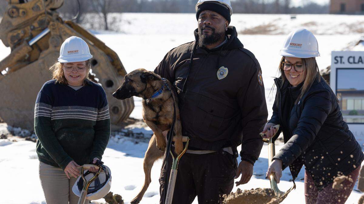 Eddie Johnson, assistant director of the St. Clair County animal control, holds Ace the Belgian Malinois during a groundbreaking ceremony for the new building on Jan. 16, 2025.