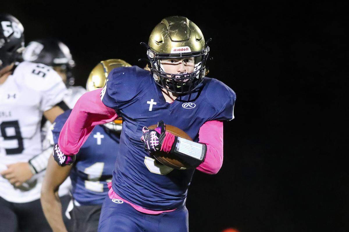 Althoff’s Grant Hoffman carries the ball during Friday night’s South Seven Conference matchup against Carbondale. The Crusaders ultimately lost 10-7.