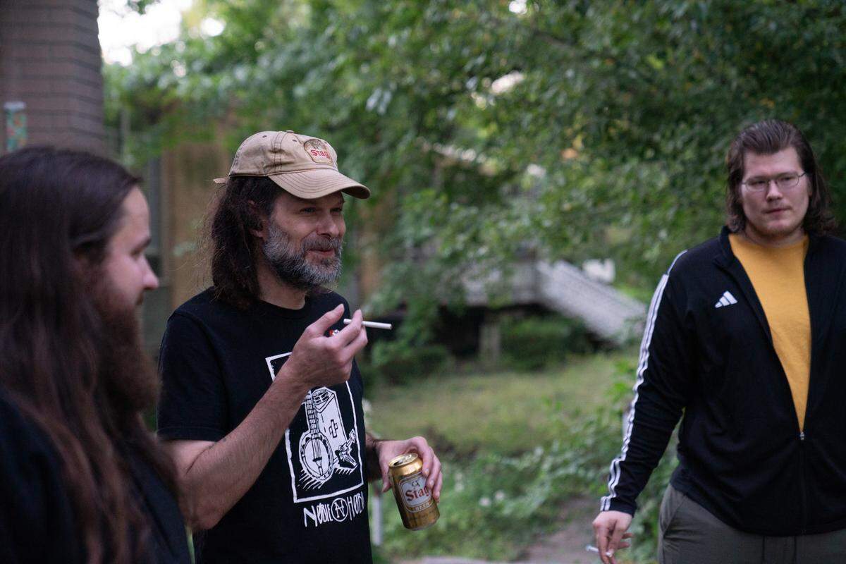Gabe Kimme (center) owns and lives at the Nunnery and greets visitors prior to the Thursday night show.