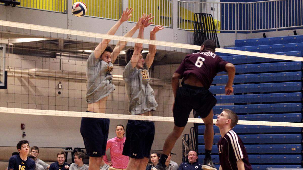 O'Fallon coach Amy Sheehan looks on as Jake Baldus (13) and Bryce Backhus (21) go for a block against Belleville West.