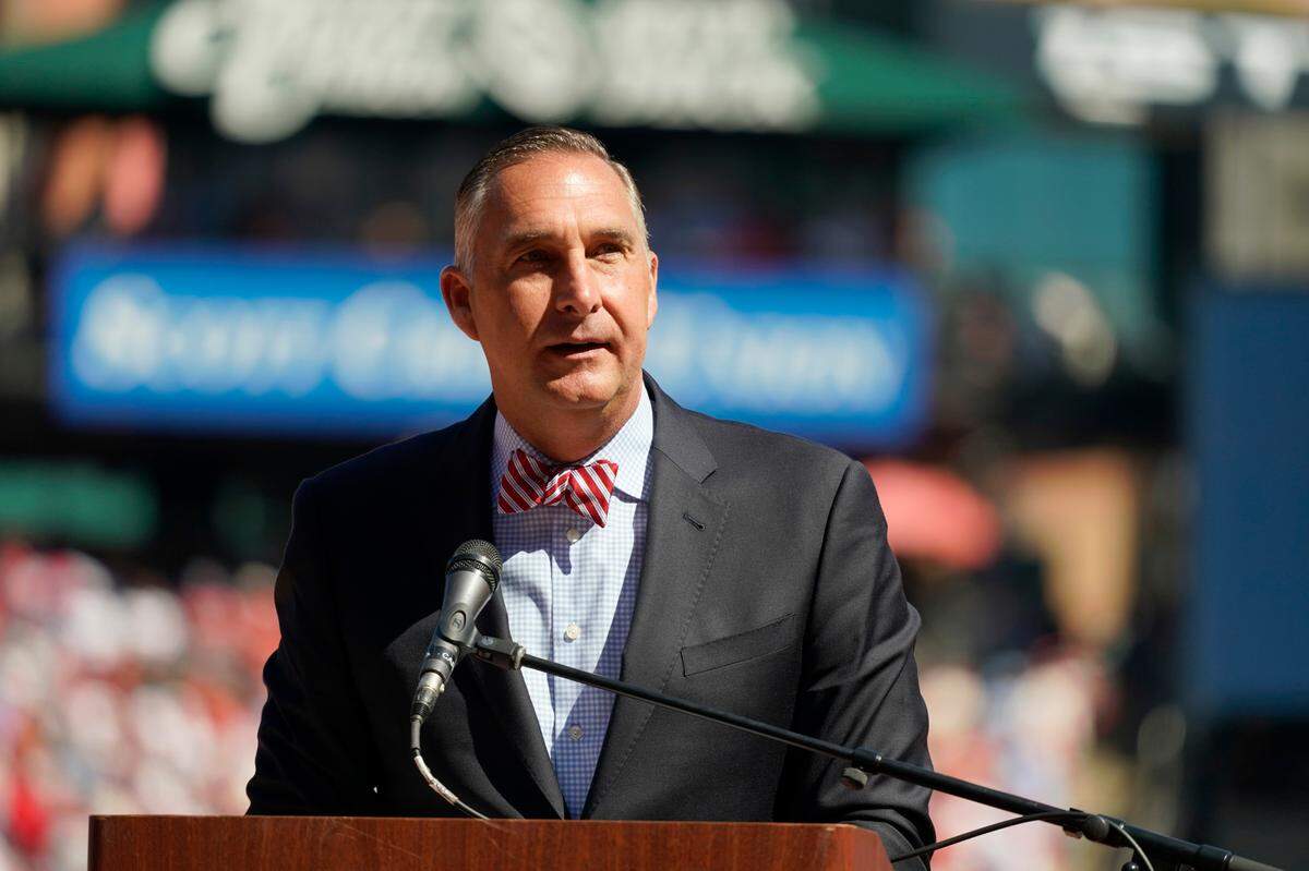 St. Louis Cardinals president of baseball operations John Mozeliak speaks as St. Louis Cardinals’ Albert Pujols (5) and Yadier Molina (4) are honored during a ceremony before the start of the final regular season game Oct. 2. The Cardinals made their first roster moves of the off-season Tuesday, which included officially filing the retirements of Molina and Pujols, bringing to an end two storied careers destined to end in enshrinement in Cooperstown.