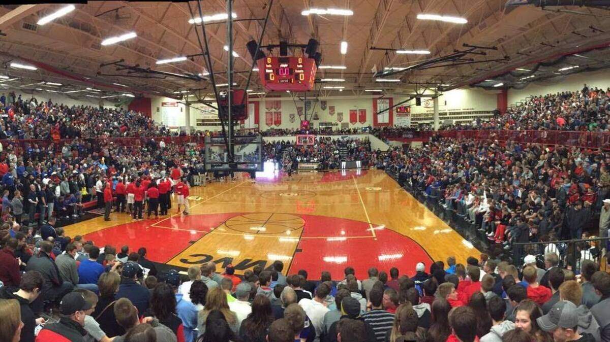 A picture of a full gym at Highland High School. This picture was taken during the Highland Optimist Shootout, while an additional set of bleachers are being used.
