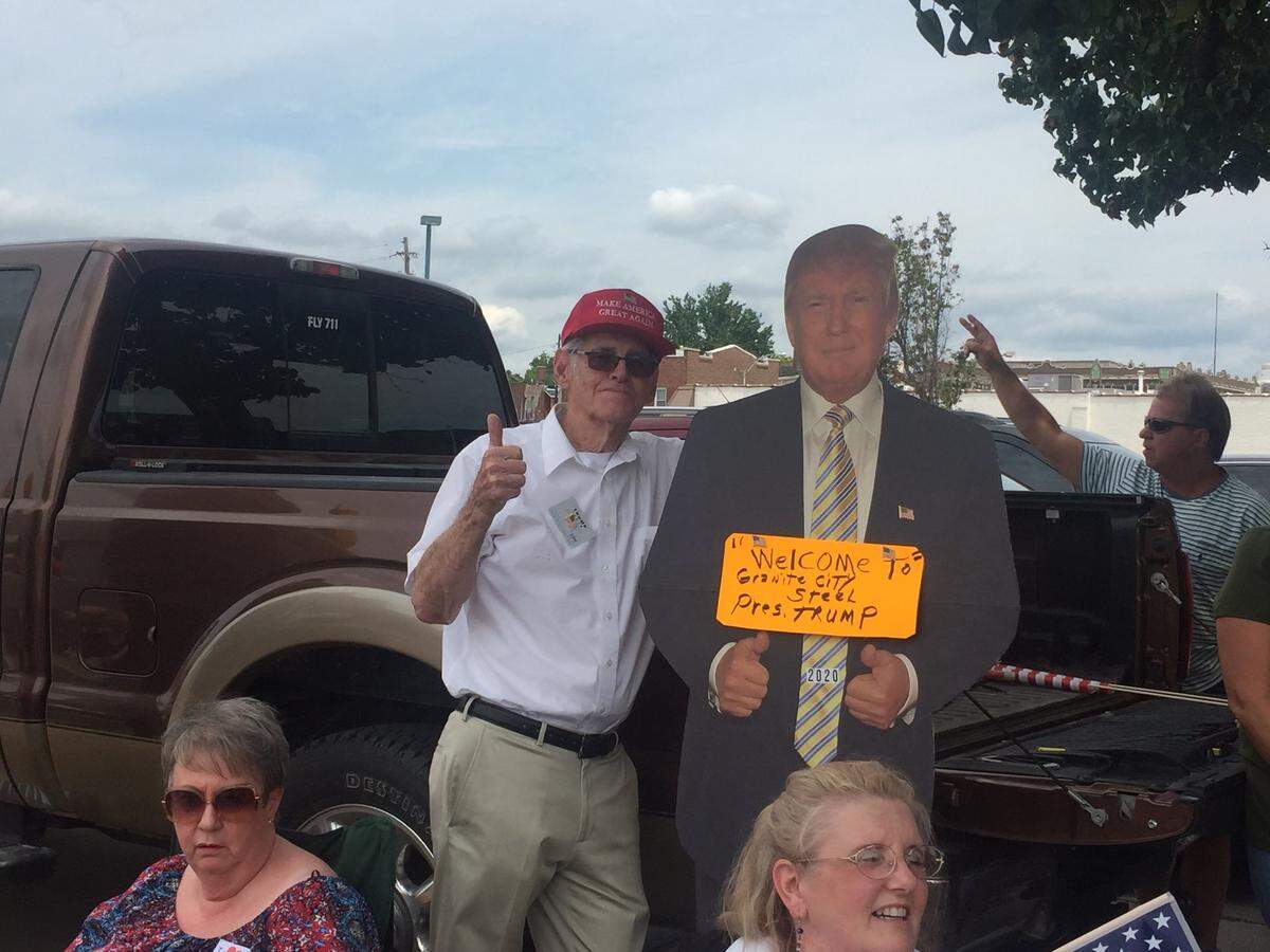 Larry Allen, of Moro, poses with a President Donald Trump cardboard cutout Thursday afternoon as he waited along the motorcade route for Trump to arrive in Granite City.
