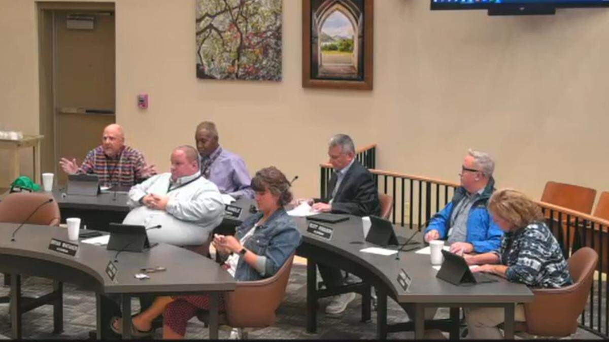 Ward 4 Alderman Raffi Ovian, left, argues in favor of an ordinance change that would finalize a salary increase for Belleville City Council members at Monday night’s meeting.