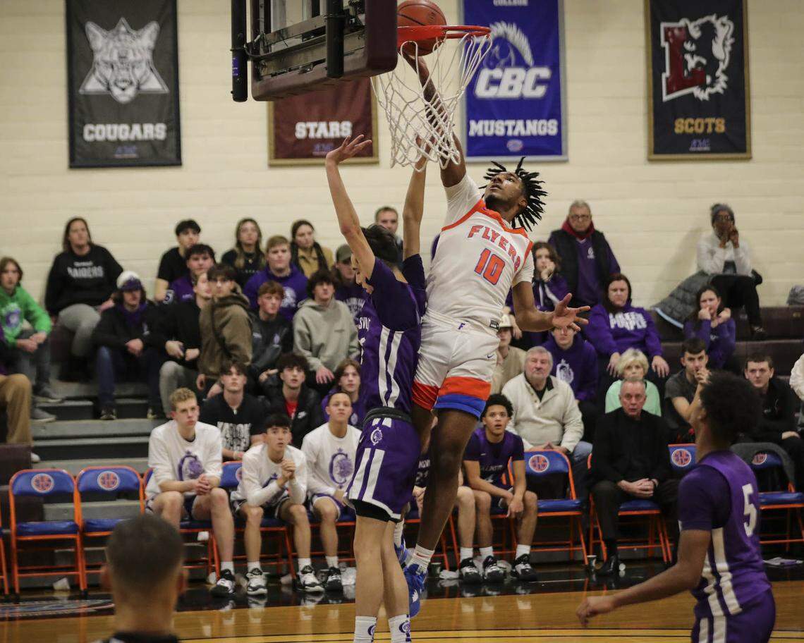East St. Louis’ Antwan Robinson works his way to the basket during a Southwestern Conference game against Collinsville earlier this season. The Flyers played in the Springfield Super-Sectional on Monday night.