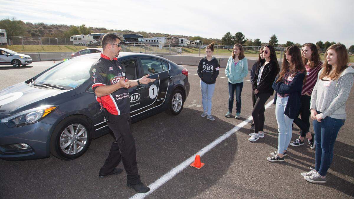 An instructor in the Be Responsible And Keep Everyone Safe, or B.R.A.K.E.S., program talks to teenagers during a recent session. The free defensive driving program for teens will be offered at Gateway Motorsports Park in Madison this weekend.