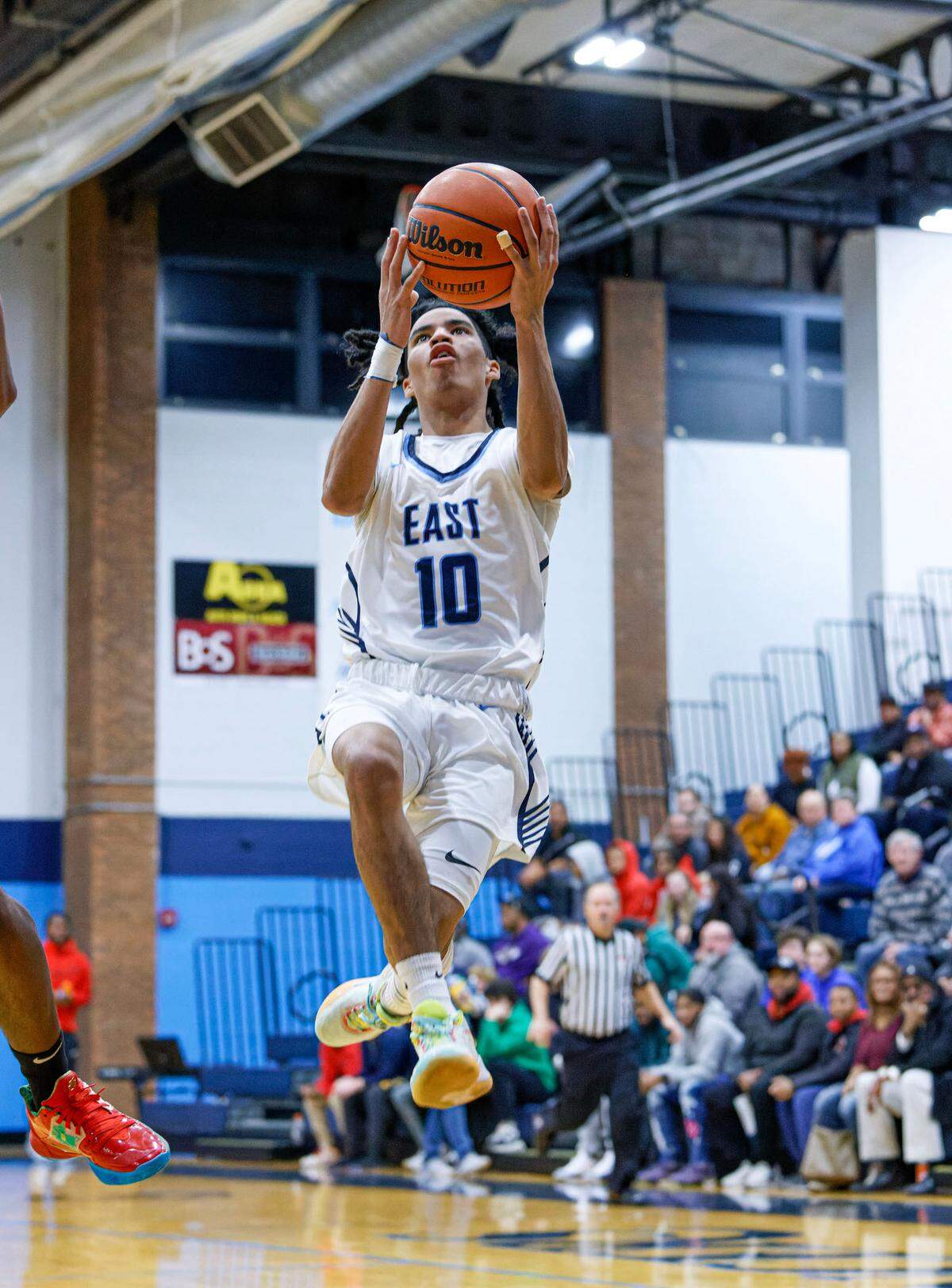 Belleville East Mason Mosley goes up for a layup during Tuesday non-conference game against Althoff. The Lancers ultimately posted a 78-50 victory.