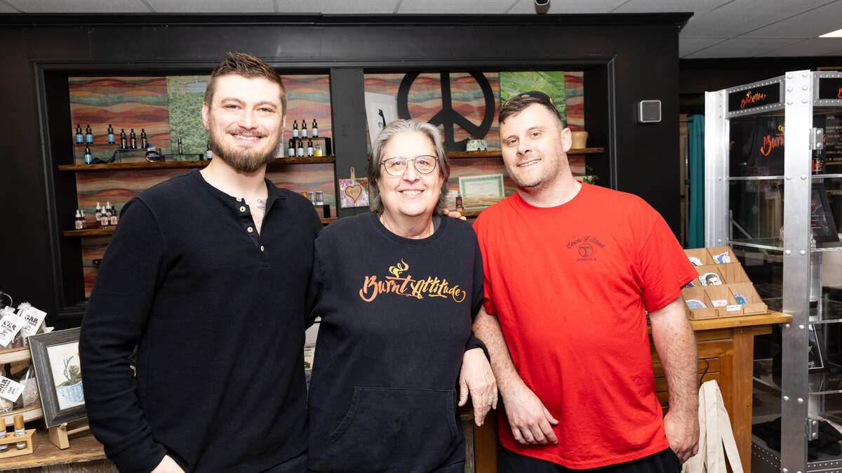 Evan and Jan Wallace, owners of Jan’s Naturals in Maryville, Ill. (L) stand next to their business partner E.J. Krause on March 8, 2024. “This place is an amalgamation of ideas,” Wallace said, “one thing just kept leading to another.”