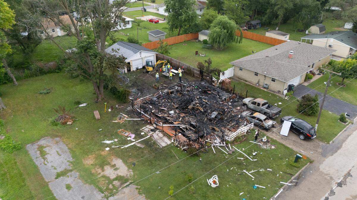 At the site of a house explosion outside of Collinsville on Monday.