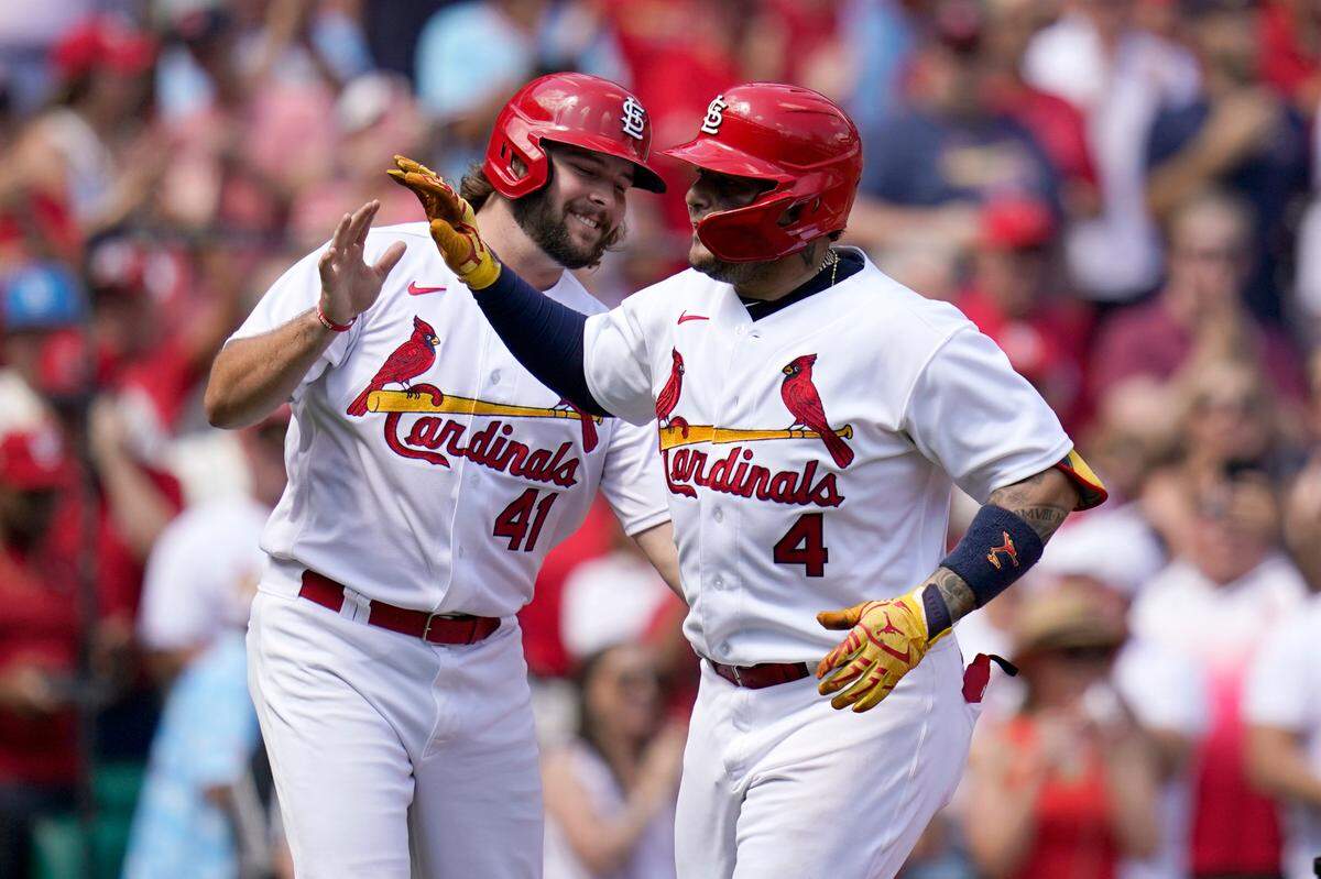 St. Louis Cardinals’ Yadier Molina (4) is congratulated by teammate Alec Burleson after hitting a two-run home run during the second inning against Washington on Thursday. The Cardinals called up Burleson after outfielder Dylan Carlson landed on the injured list with a thumb sprain.