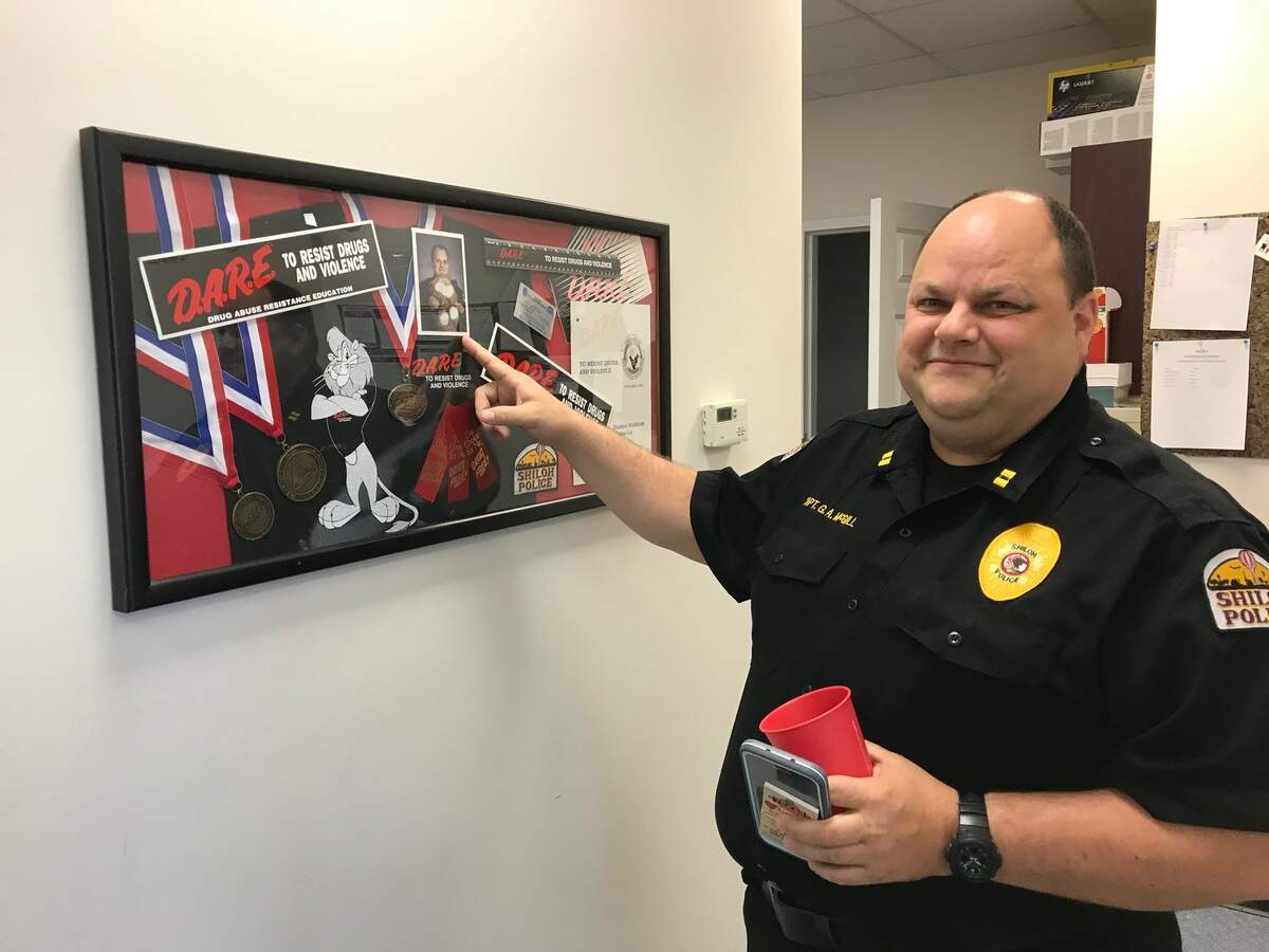 Shiloh Police Deputy Chief Gary McGill's is retiring after 30 years on the force at the Shiloh PD. His last day is Friday. Here he is pointing at a photograph of himself when he joined Shiloh PD in the late 1980s.