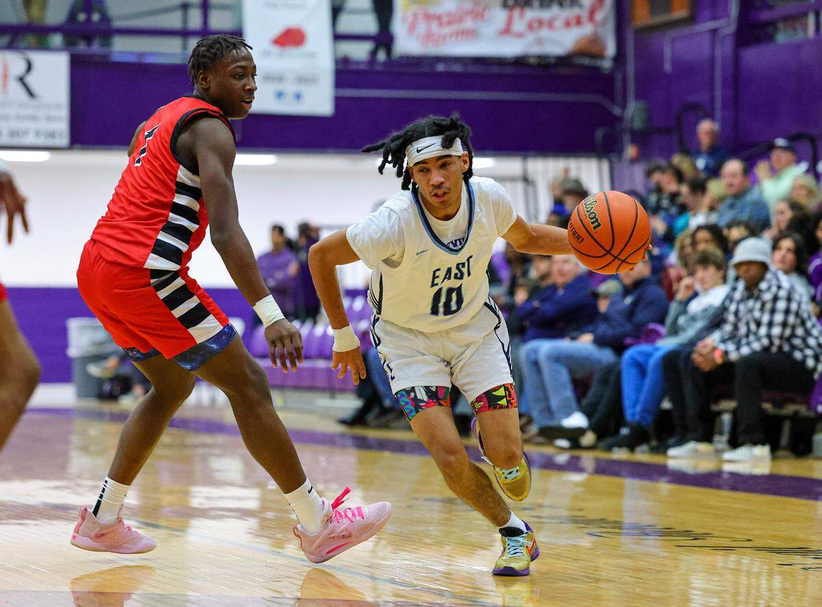 Belleville East’s Mason Mosley drives to the basket against Rockford East in the third place game of the 38th annual Prairie Farms Collinsville Holiday Classic.