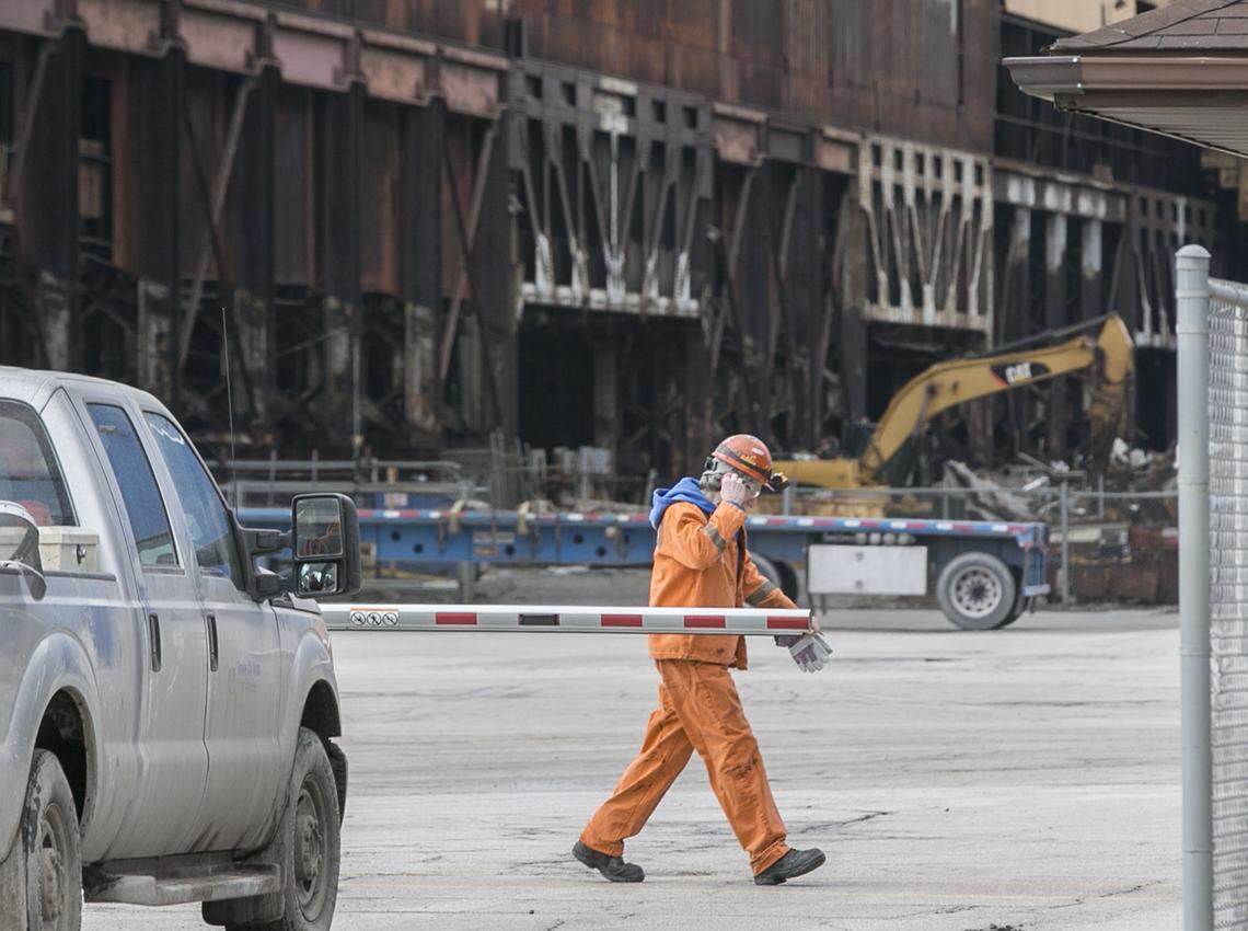 A United States Steel employee walks pass the Nash Street gate Wednesday. U.S. Steel announced the startup of a blast furnace and potential for up to 500 jobs returning starting this month at its Granite City Works plant.