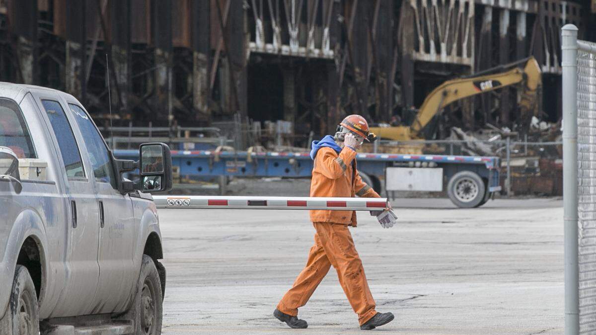 A United States Steel employee walks pass the Nash Street gate Wednesday. U.S. Steel in March of 2018.