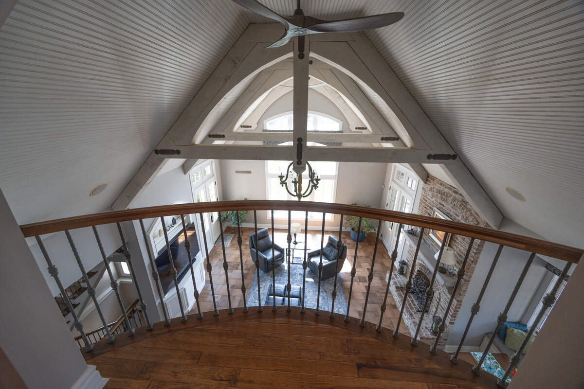 The top floor of the home comes with a balcony to overlook the open floor plan below.