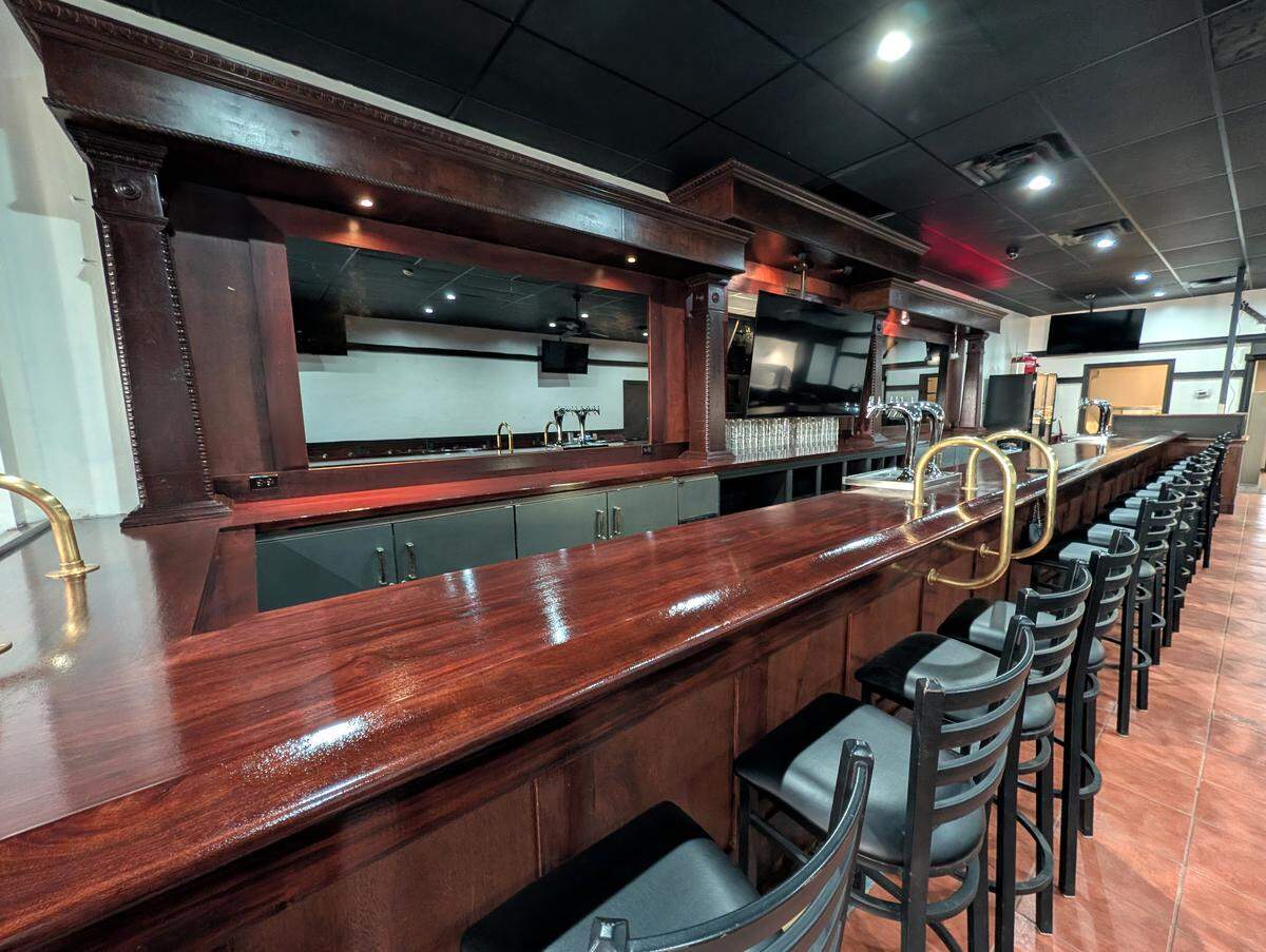 The double bar at The Roundabout in downtown Belleville offers plenty of seating and two spots for placing orders.