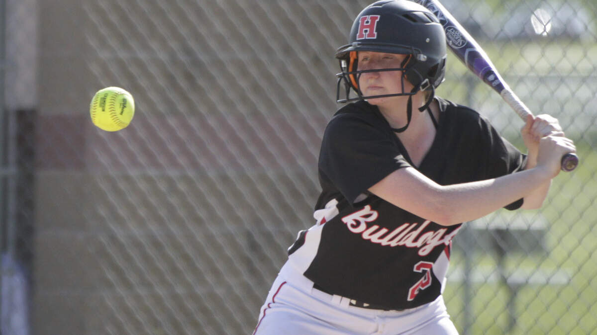Highland's Lauren Baer eyes a pitch in the Bulldogs' game on May 16 with Triad.