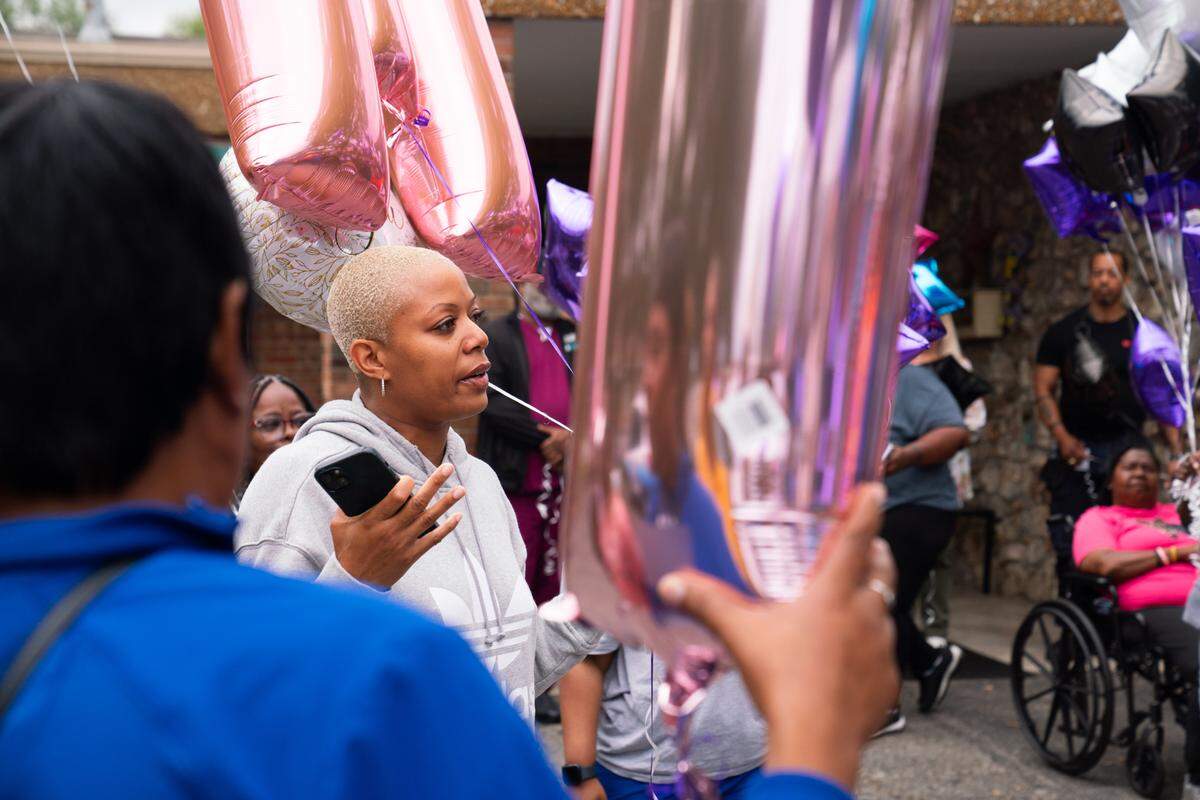 Shell Washington, sister of hit-and-run victim Latasha Johnson, speaks before a balloon release in her memory in Cahokia Heights, Ill. on Sept. 13, 2024. “Tasha loved everybody, always made them laugh, and she loved all of y’all,” Washington said, “I won’t say I love you all from the bottom of my heart, because my love for you is at the top.”