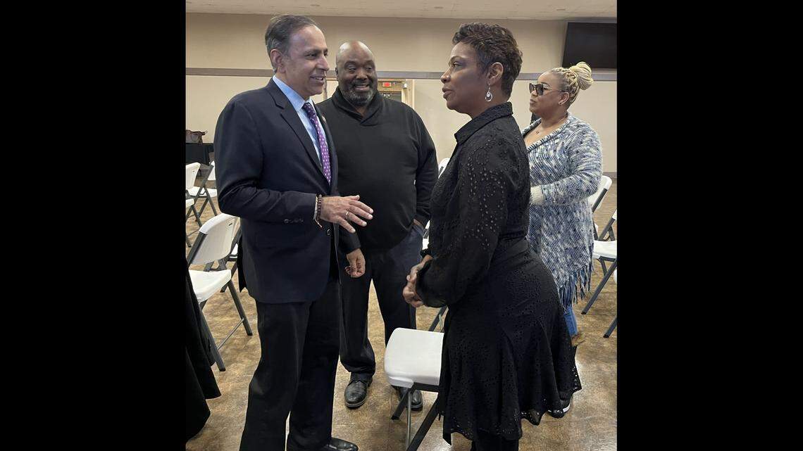 U.S. Rep. Raja Krishnamoorthi, left, talks to Gina Jackson, owner of Billie’s Pastries in East St. Louis, as East St. Louis Township Supervisor Rick Easton listens on Saturday at Clyde C. Jordan Senior Citizen Center. Also pictured is Tenisha McIntosh, the township’s building manager.