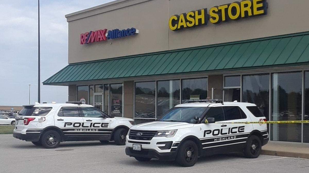 Police on the scene of a reported armed robbery of the Highland Cash Store on Saturday.