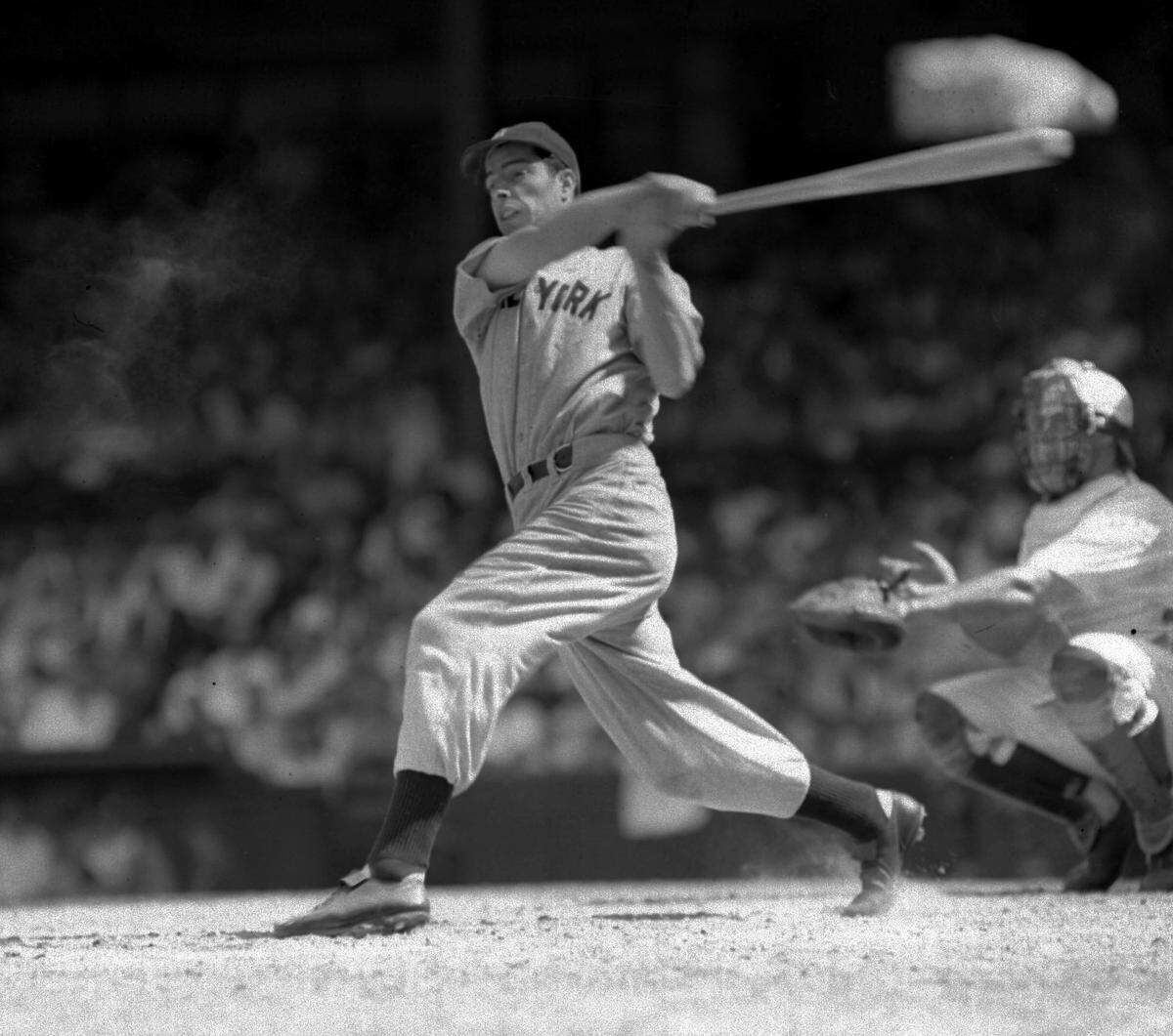 Joe DiMaggio lines a single to left field in the seventh inning of the second game of a doubleheader at Washington June 29, 1941, to set a record for hitting safely in 42 consecutive games. In the first game, DiMaggio tied George Sisler’s record of 41 games, set in 1922. The catcher is Jake Early of the Washington Senators. Yankees won both games, 9-4, 7-5. (AP photo)