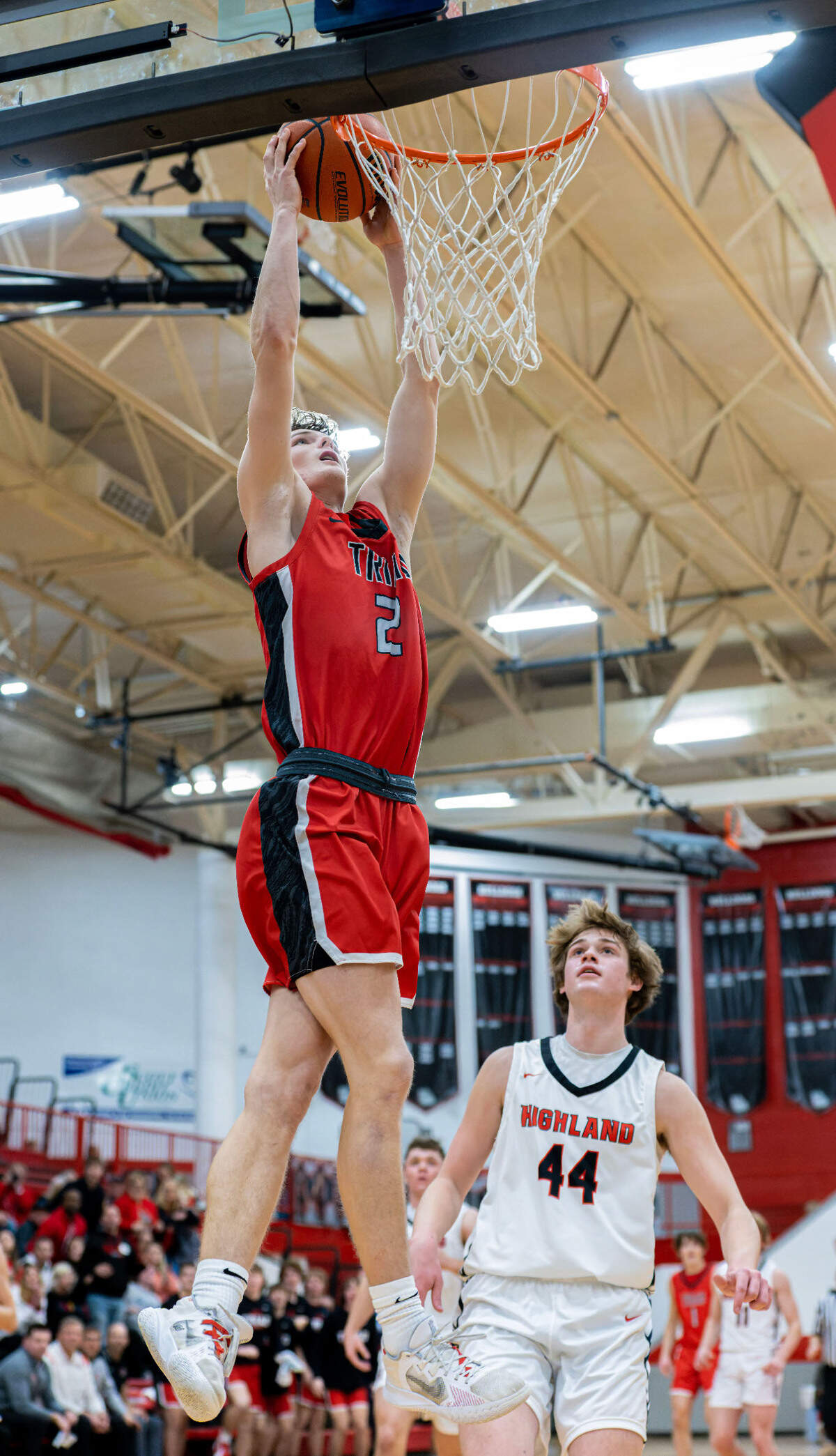 Triad’s Jake Stewart goes up for the dunk during Friday night’s Mississippi Valley Conference game against Highland. The Knights ultimately posted a 50-37 victory.