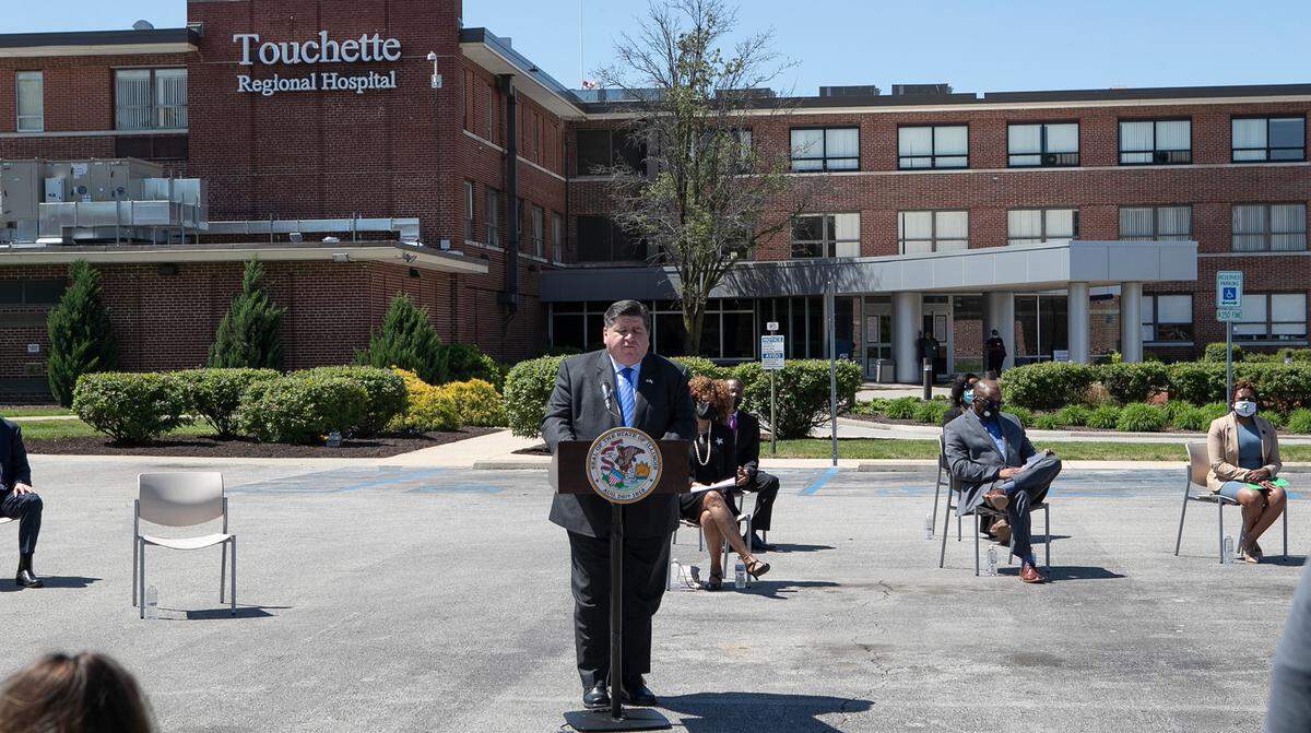 Illinois Gov. J.B. Pritzker discusses a new health-care law during a news conference on Friday at Touchette Regional Hospital in Centreville.