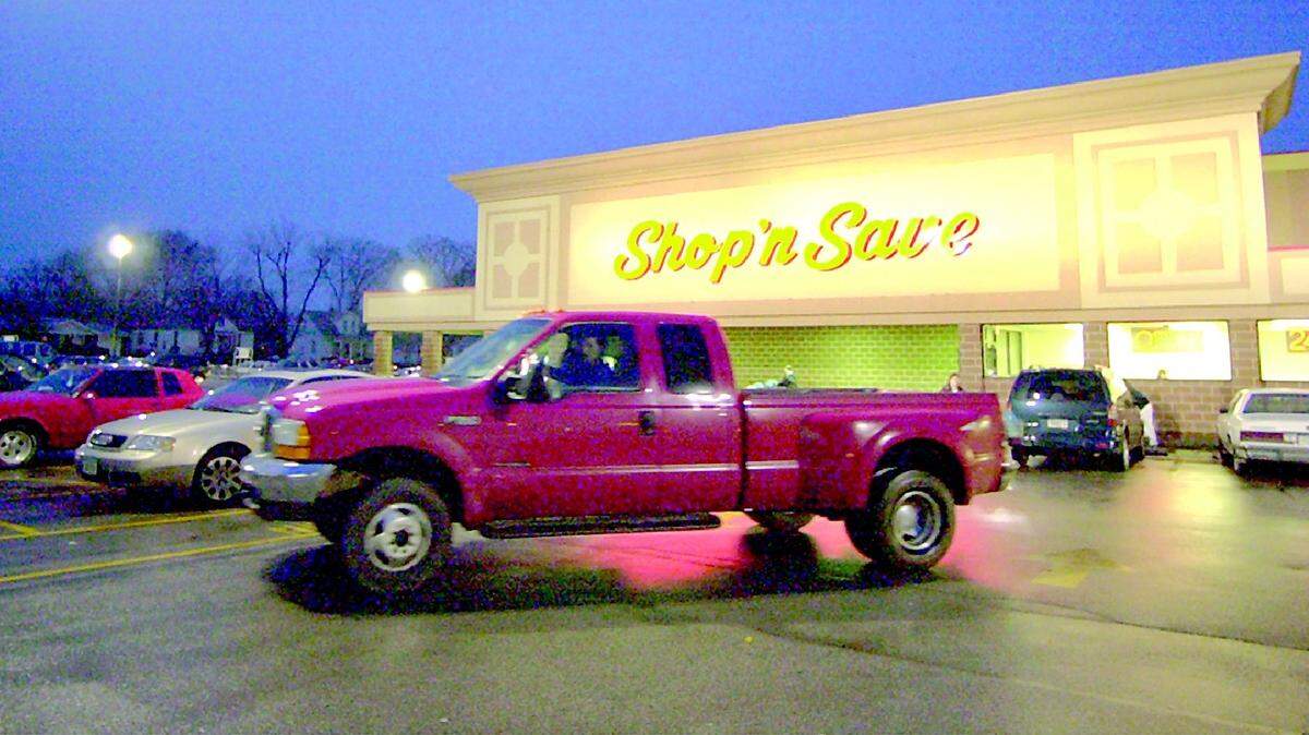 A view of a Shop 'n Save grocery store at night.