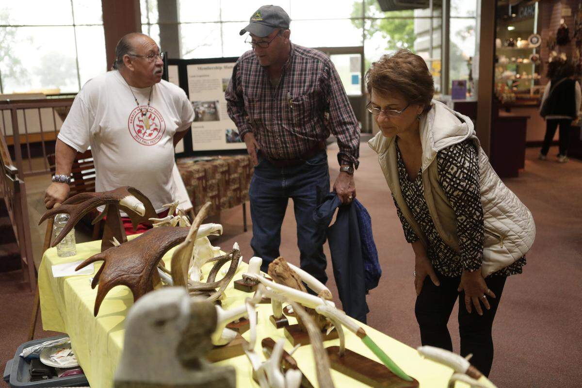 Artist David Farnham chats with John and Pam Danner of Mount Vernon during last year's Cahokia Mounds Spring Indian Market Days. The 2018 Spring Indian Market Days will be from noon to 5 p.m. Friday and 9 a.m. to 5 p.m. Saturday-Sunday, April 27-29, 2018, at Cahokia Mounds State Historic Site, Collinsville.